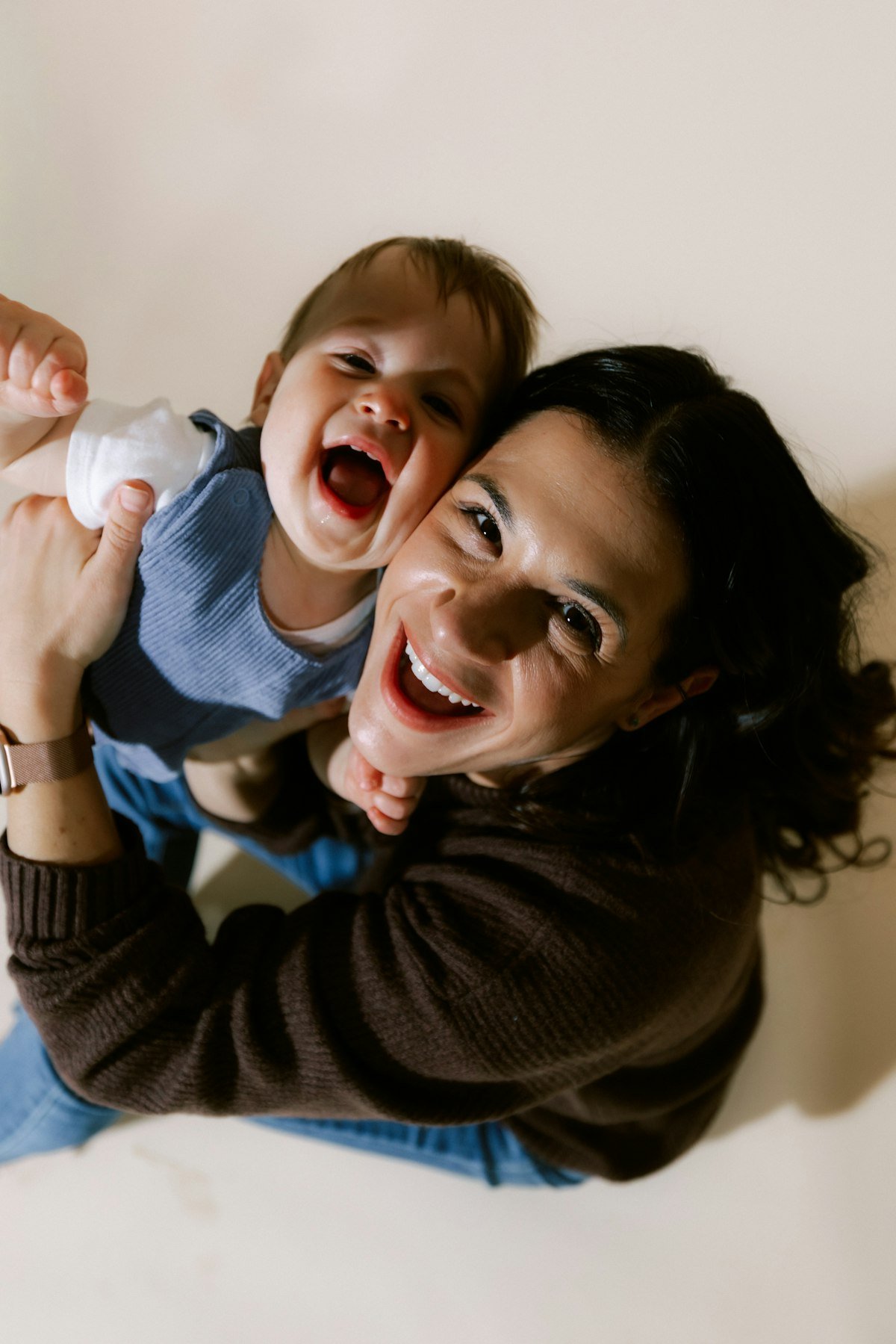 Happy mother laughing with her baby, a Becky's Baby Shop customer